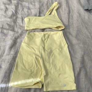 Alo biker short and one shoulder bra set.